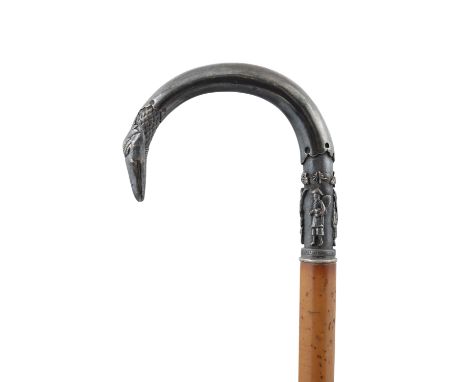 A VERY FINELY CHISELED SILVER HILTED WALK STICK WITH AN INSCRIPTION VIETNAM, LATE NGUYEN DYNASTY, CIRCA 1900 The grip, shaped