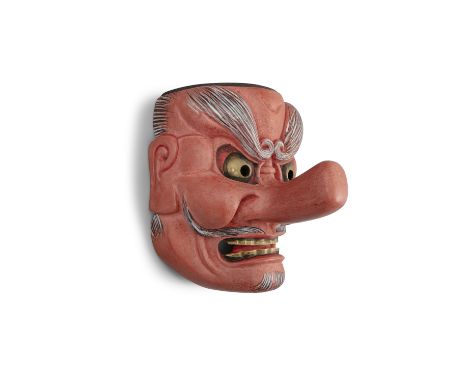 A KYOGEN THEATER MASK OF AN ANGRY TENGU 天狗  Japan, Showa period  A lacquered wooden mask with brass eyes.  H: 21 cm - w: 17 c
