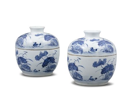 A PAIR OF BLEU DE HUE ‘MANDARIN DUCKS AND LOTUS POND’ PORCELAIN LIDDED POTS VIETNAM, POSSIBLY LATE NGUYEN DYNASTY Finely pain