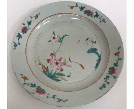 A pair of Chinese famille rose palette chargers decorated with hooded cranes and blossoming foliage, 38 cm diameter CONDITION