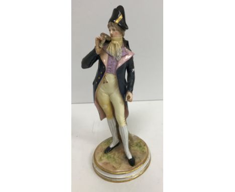 A late 19th Century Meissen figure of "A gallant standing by tree stump in 18th Century dress", bears blue crossed swords mar