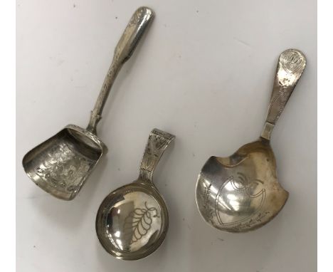 A Georgian silver caddy spoon, the bowl of simple circular form (by Cox &amp; Bettridge, Birmingham 1808), a further Georgian