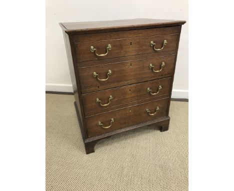 A 19th Century oak commode chest converted to two door cupboard, raised on bracket feet, 63.5 cm wide x 75.5 cm high