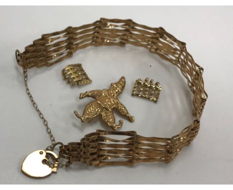 A 9 carat gold gate link bracelet with heart shaped lock, 6.2 gms, together with a yellow metal brooch of a clown and two yel
