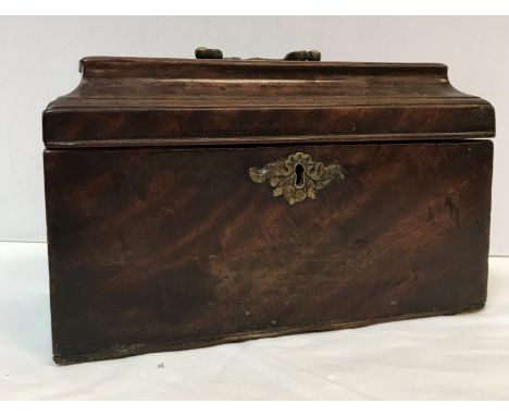 A George III mahogany sarcophagus shaped tea caddy with ornate brass swan neck handle 25.5 cm x 13 cm x 15 cm high (interior 