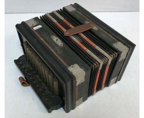 An ebonised cased "The Winner" tremolo piano accordion with steel bronze reeds, the metal brackets stamped "Ludwig Parsifal M