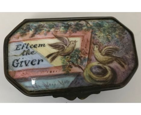 A Staffordshire enamel patch box of elongated octagonal form, the hinged lid with bird and nest decoration inscribed "Esteem 