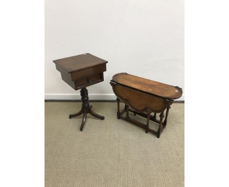 A 20th Century walnut miniature drop-leaf gate-leg table in the William and Mary taste, raised on turned cup and cover suppor