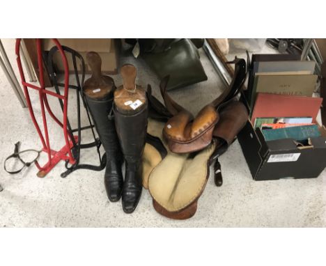 A pair of black hunting boots with wooden trees, together with a pair of oak horseshoe shaped whip or coat racks with brass h