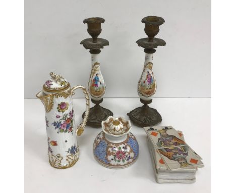 A pair of 19th Century porcelain and cast brass baluster shaped candlesticks, the main bodies enamel decorated with two gentl