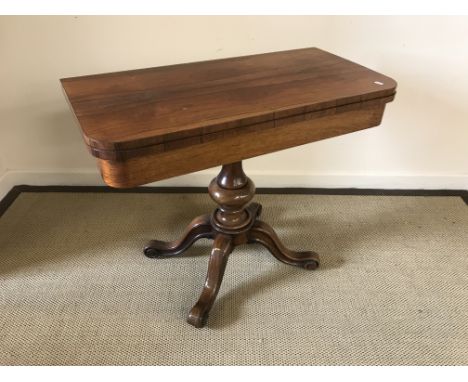 A Victorian rosewood fold-over card table on pedestal quadruped base and scroll feet, 92 cm wide x 75.5 cm high, together wit