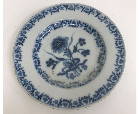A collection of various Delft ware including a small circular plate with central floral spray decoration, 23 cm diameter, a p