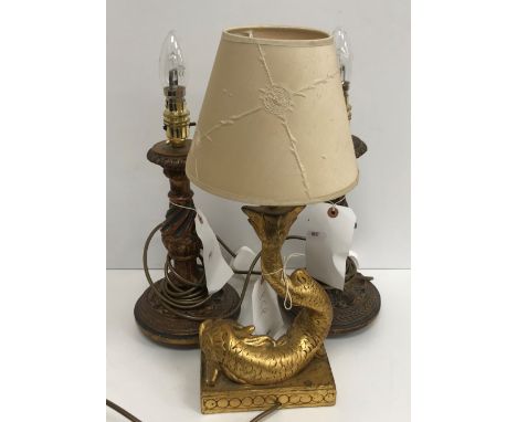 A pair of wooden gilt decorated table lamps with wrythen and acanthus leaf decoration 27 cm high excluding fittings together 