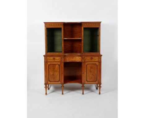 GILLOWS OF LANCASTER: A Sheraton revival satinwood and marquetry cabinet, the upper section with twin glazed cupboards enclos