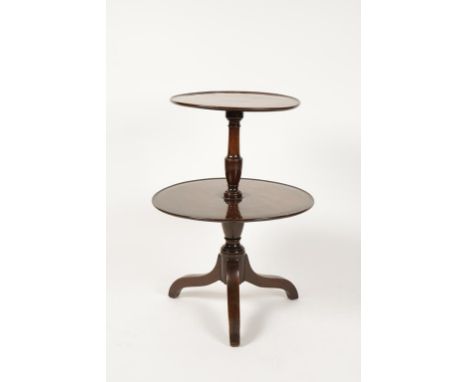 A LATE GEORGE III MAHOGANY "DUMB WAITER" with two graduated circular tiers, on a baluster shaft and an inverted tripod base, 