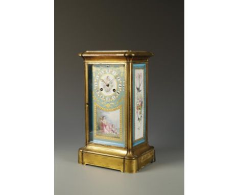 A 19TH CENTURY FRENCH GILT METAL AND CERAMIC MANTEL CLOCK, the dial of "Sevres" style porcelain painted with a lady playing a