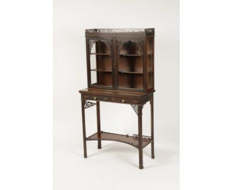 A VICTORIAN MAHOGANY "CHIPPENDALE REVIVAL" DISPLAY CABINET, the upper section with a pierced border above twin glazed doors e