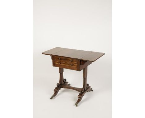 A REGENCY ROSEWOOD WORK TABLE inlaid with brass stringing, the rectangular flap tops over an arrangement of two drawers with 