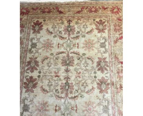 AN AFGHAN ZIEGLER TYPE SMALL CARPET, the ivory ground worked with pastel shaded stylized leafage and flowerheads, within conf