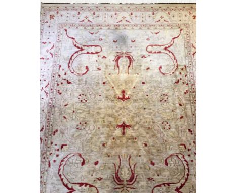 AN AFGHAN ZIEGLER TYPE SMALL CARPET, the pale lemon ground worked with magenta and pastel shaded stylized leafage and flowers