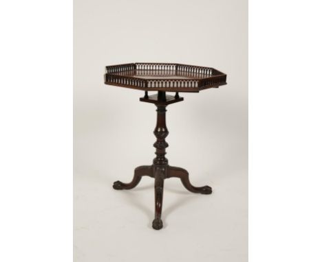 A GEORGE III MAHOGANY TRIPOD TABLE, the octagonal top with pierced Gothic arched gallery over a bird-cage, on a baluster and 