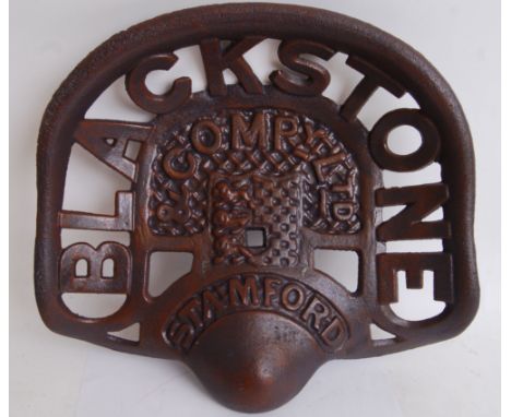 A vintage style 20th century cast iron brown Blackstone tractor seat. Measures approximately 39cms wide. &nbsp;