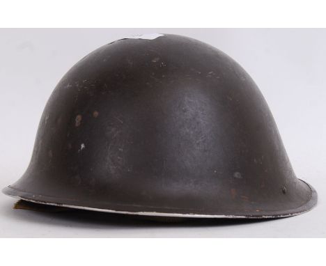 An original Second World War WWII believed European military helmet with original liner. POSTAGE: Worldwide postage / deliver