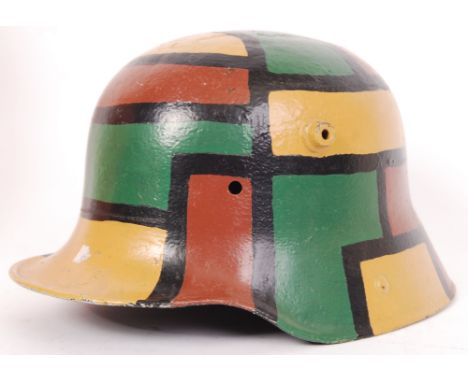 An original WWI First World War era German army camouflage helmet. Restored / repainted condition.&nbsp;