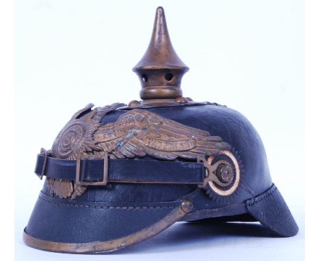 An original WWI First World War era Prussian / German Garde Pickelhaube uniform helmet. Leather construction, with brass spik