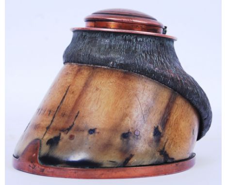 A WWI First World War era trench art style inkwell made from a horses hoof. Copper inkwell and decoration to the top. The hor