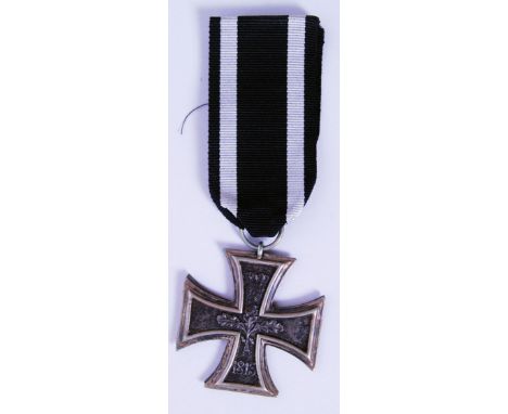 A replica WWI First World War German Iron Coss medal - with black and white ribbon. Stamped 1813 with central leaves, the oth