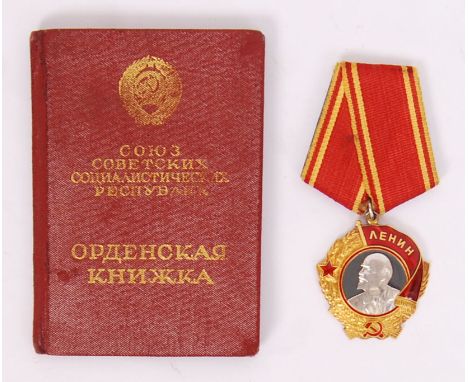 An original Soviet Russian issue Order Of Lenin award. Awarded to a Bayzarak Anastasia Gavrilvna. Numbered 94173, along with 