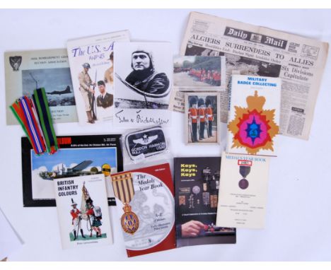 A collection of vintage 20th century ephemera medal ribbons, books, photos, postcards etc.  POSTAGE: Worldwide postage / deli