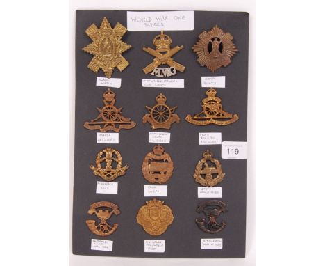A collection of original WWI First World War uniform cap badges - all neatly displayed on a sheet of card. Featuring badges f