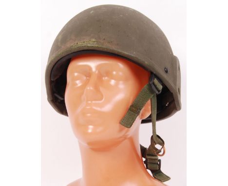 An original post WWII Tank Corp driver helmet. In green, complete with original liner and canvas strapping.