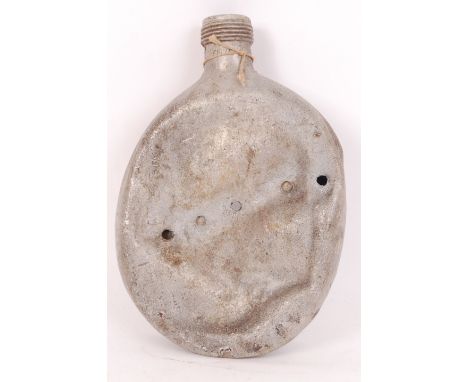 An original possibly WWI First World War (or WWII) era uniform issue aluminium water bottle. ' Battle damaged ' with machine 