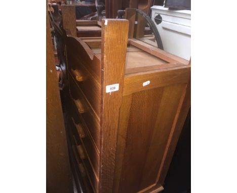 Two oak chests of drawers, one light, one dark. 