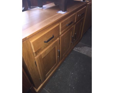 A modern light oak sideboard, length 145cm, depth 47cm and height 83cm. 