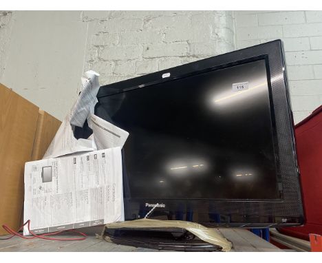 A 26" Panasonic LCD TV with remote and instructions manual. 