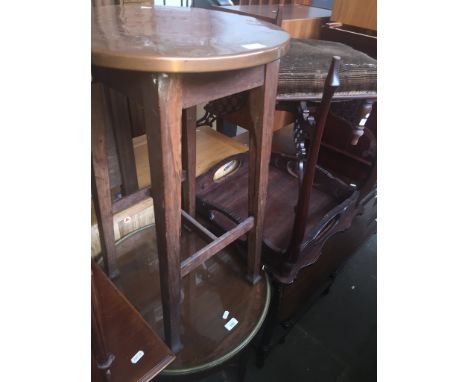 An Edwardian inlaid mahogany and glass top table and an oak and copper top table of a similar age. 