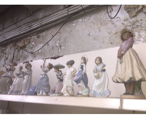 11 Nao figurines including Ballet dancer, 2 seated girls, child with puppy, and large figure of girl holding bouquet etc"Girl