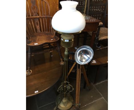 A floor standing parafin lamp with brass stand, height 168cm. 