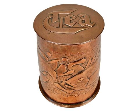 A Newlyn cylindrical copper tea caddy Repousse decorated with two fish, on a matt ground, impressed mark, height 10cm, diamet