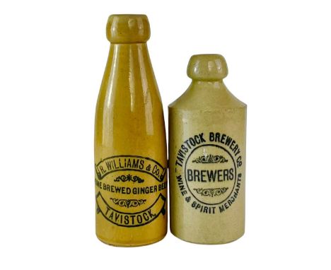 A Tavistock Brewery Co stoneware ginger beer bottle. Height 17cm, together with an R. Williams &amp; Co bottle (cracked) (2).