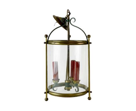 A brass and glass cylindrical hall light. 20th century, with three fittings, height 43cm.