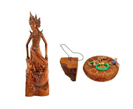 A finely carved Balinese hardwood figure of a Deity. 20th century, height 29.5cm, together with a hardwood pipe stand, and a 