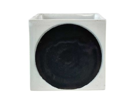 A Troika pottery for Heals cube vase. With an early Troika print mark to the base, circular design to all sides, height 8cm.T