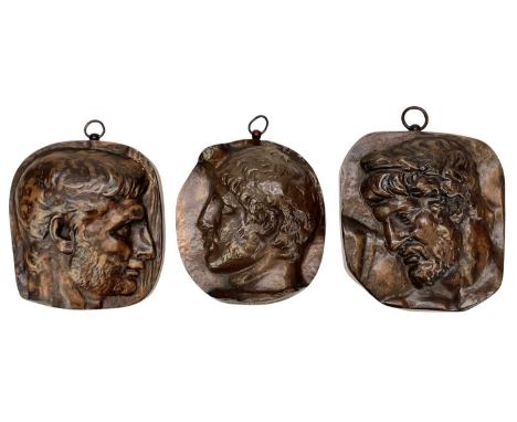 Three 19th century French bronze wall plaques.  Each cast with a profile portrait of a classical male, and bearing cast inscr