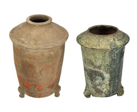 Two Chinese pottery granary jars. Han dynasty, one with traces of red pigment, height 30cm, the other in grey pottery, height
