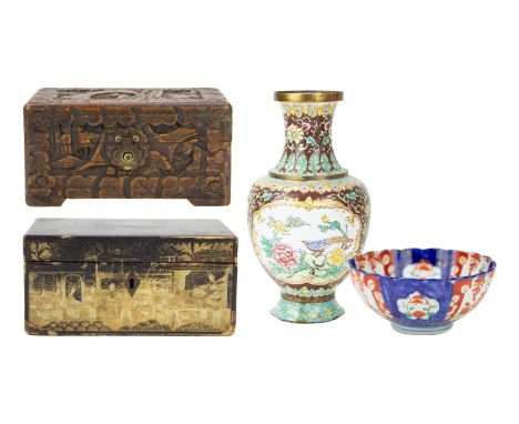 A Chinese export black lacquer tea caddy. Circa 1820, gilt decorated and with a pewter lined and lidded interior, height 9cm,